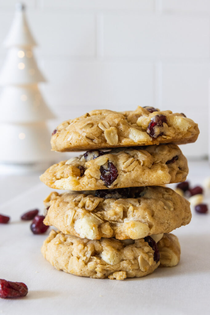 Cranberry white chocolate cookies stacked on top of each other
