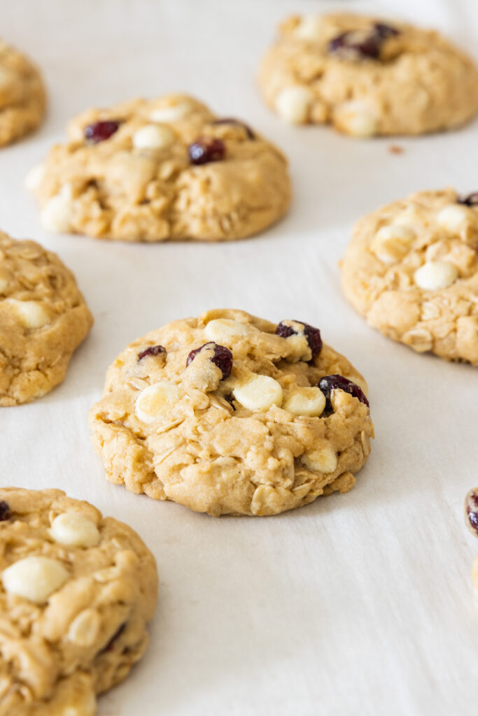 Cranberry White Chocolate Cookies fresh from the oven on a baking sheet tray